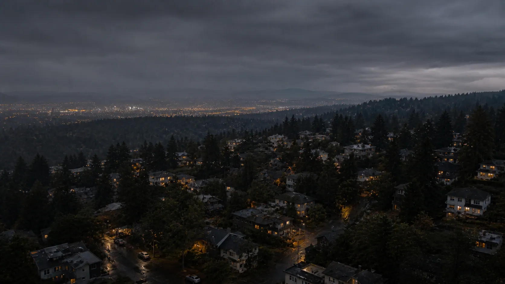 Atmospheric aerial view across a Pacific Northwest residential market at blue hour